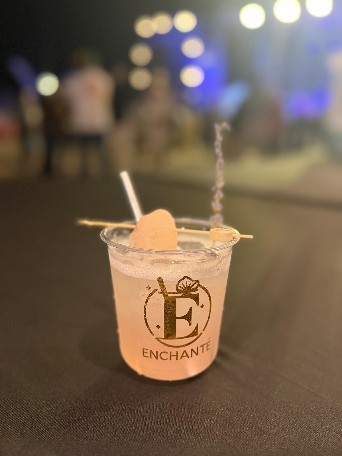 Blush ENCHANTÉ cocktail with lavender garnish
